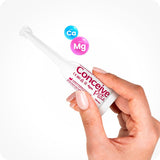 Conceive Plus Maximum Fertility Bundle (ES) Fertility Lubricant 4g prefilled applicator with calcium and magnesium ions to support sperm viability and balanced pH — image shows a single-use white applicator marked with pink branding held gently between thumb and index finger, accompanied by floating Ca and Mg ion graphics on a clean white background.